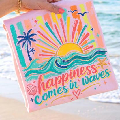 Colorful pouch with beach-themed design and 'happiness comes in waves' text held by a hand by the water.