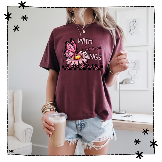 With Brave Wings She Flies